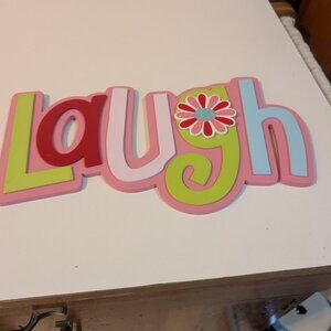 Wooden colorful "Laugh" wall hanging